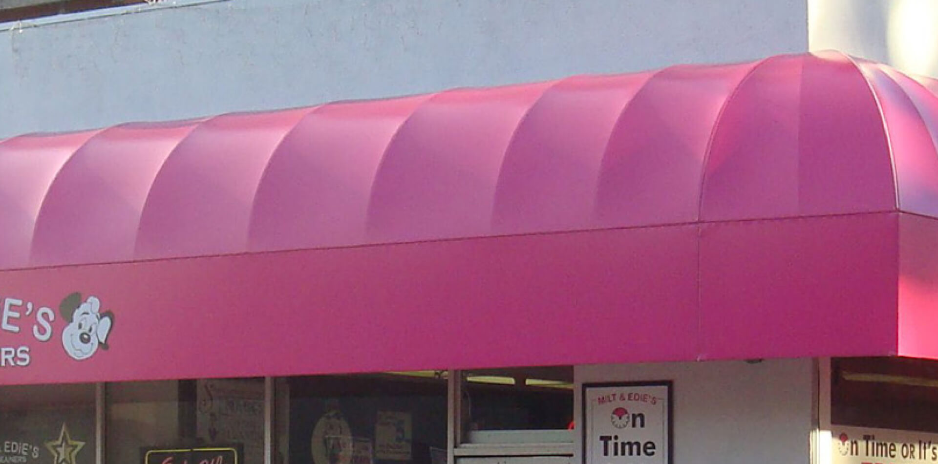 Pink fixed canvas awning above a storefront, Los Angeles