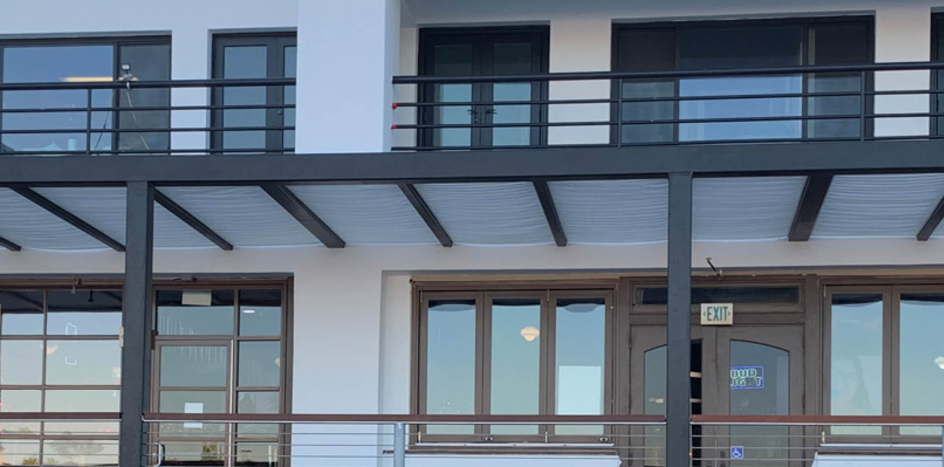 Metal-framed translucent canopy on a commercial building, Riverside County