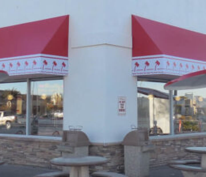 Red-and-white fixed canvas awnings above restaurant windows, Los Angeles