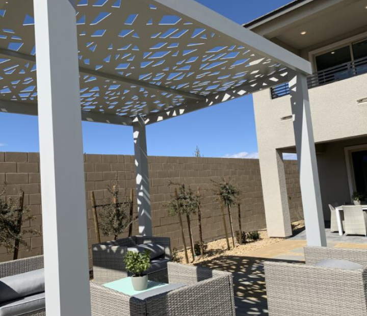 Decorative open metal trellis casting a geometric shade pattern