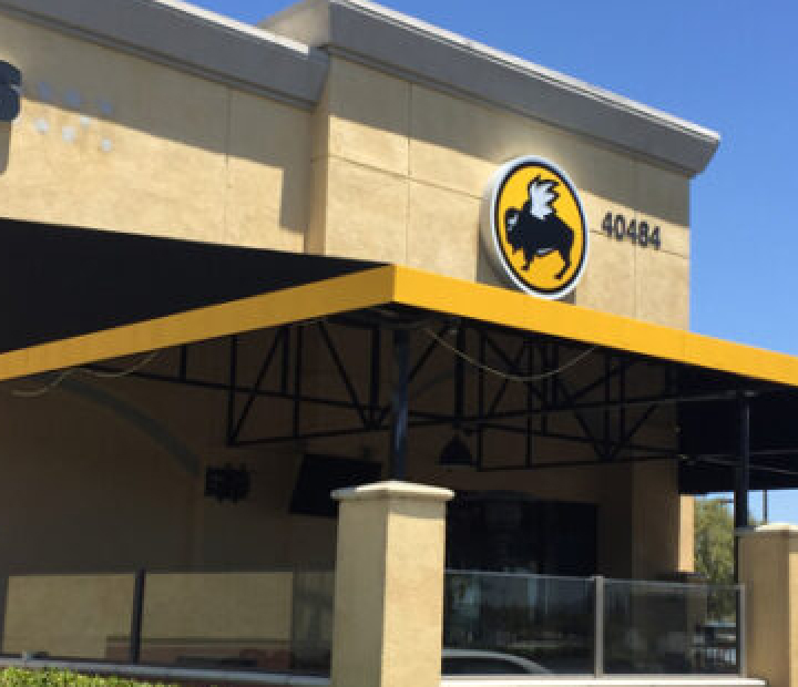 Black-and-yellow patio cover at Buffalo Wild Wings, Orange County