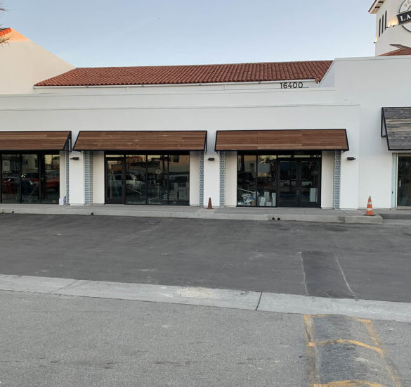 Row of matching metal awnings on a retail building, Orange County