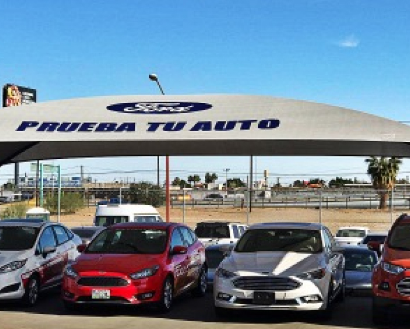 Branded car dealership canopy over parked cars, Riverside County