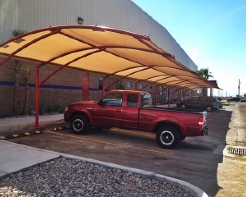 Arched fabric parking canopy over a pickup truck, Riverside County