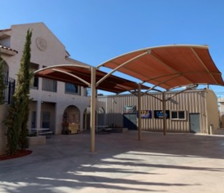 Double-arched fabric canopy over a loading area, Riverside County