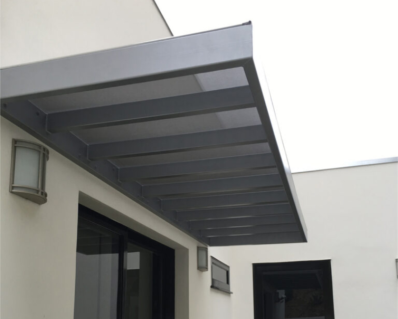 Wall-mounted metal trellis above patio doors, Riverside County