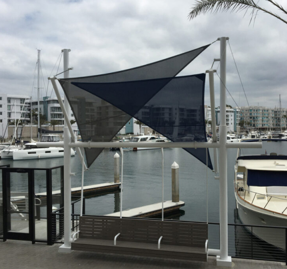 Dark shade sail above a marina walkway, Riverside County