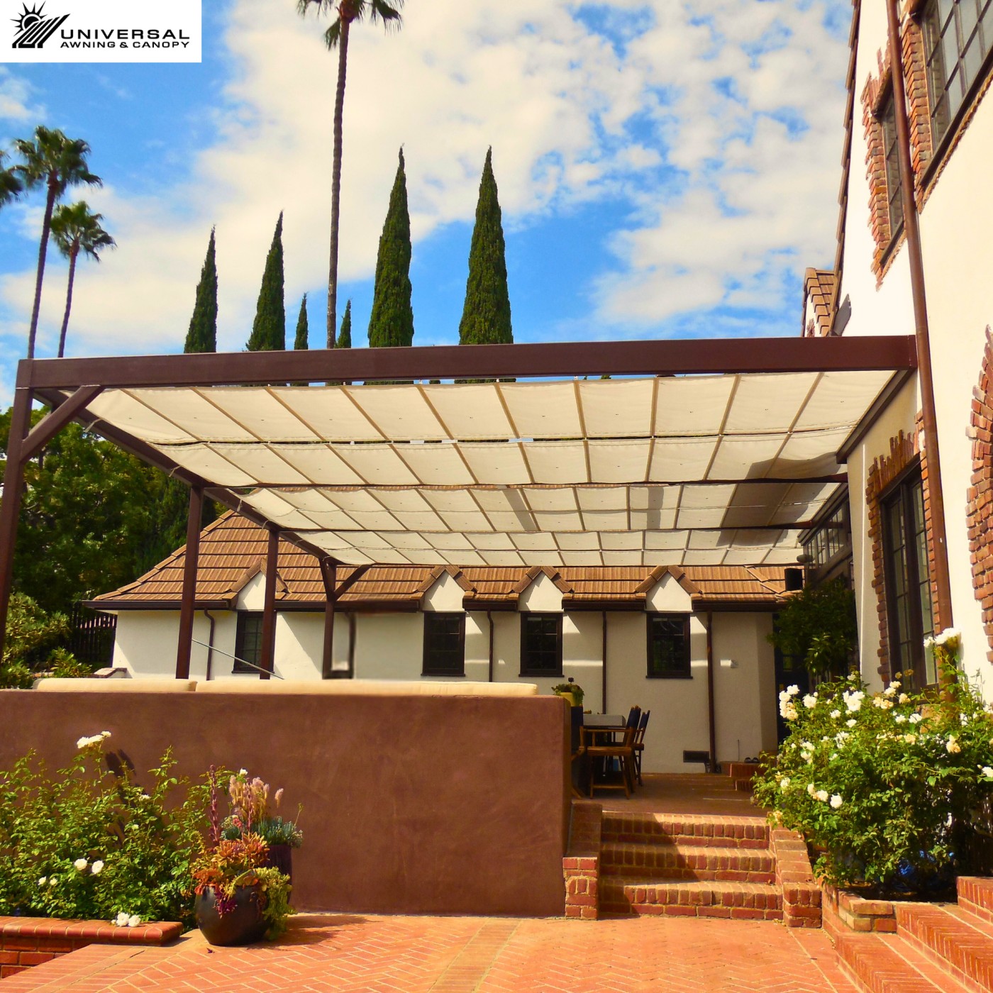 Custom fabric canopy over a residential courtyard