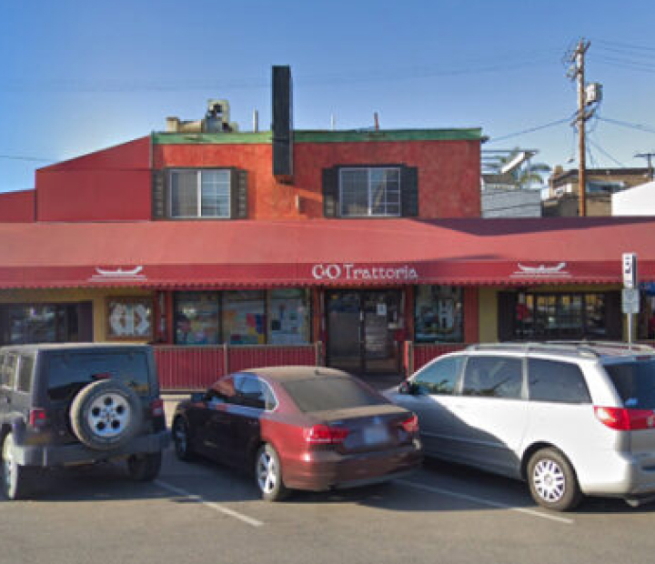 Red fixed awnings above a restaurant patio, Orange County