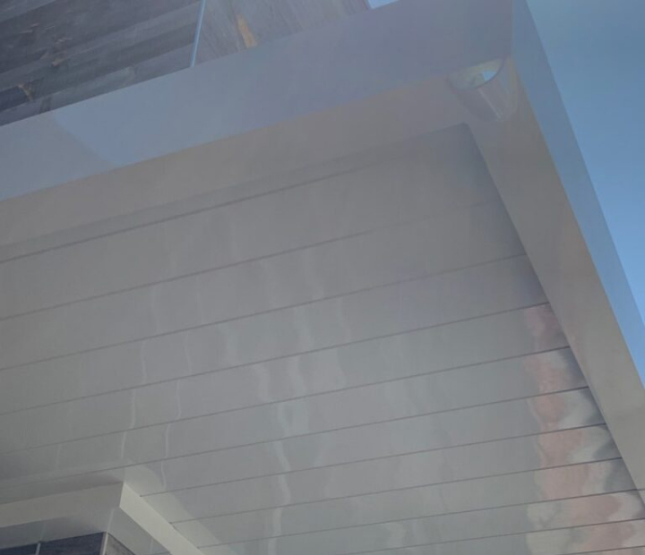 Finished underside of a white metal canopy, Orange County