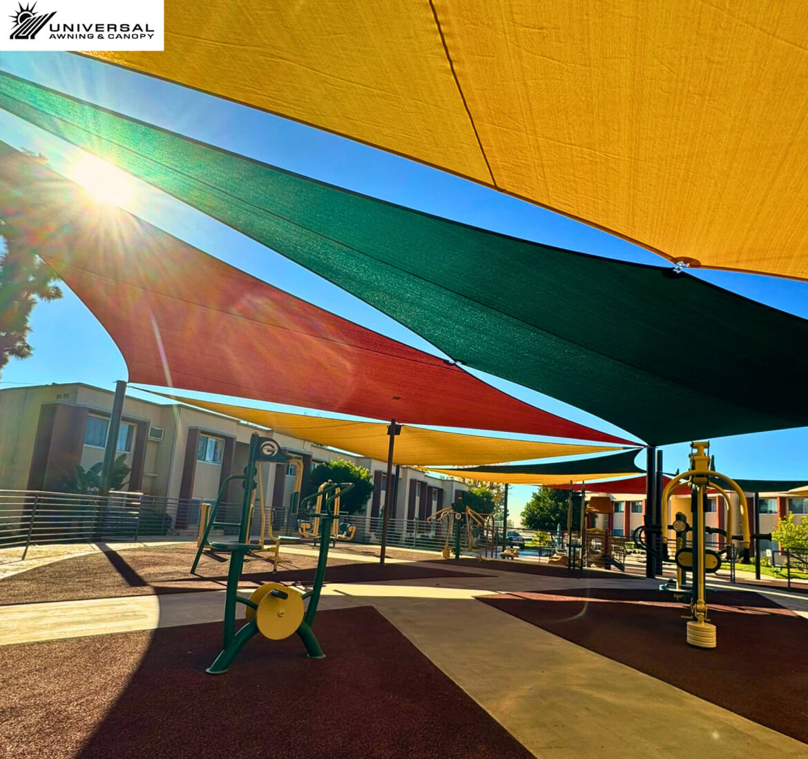 Colorful shade sails over an outdoor recreation area
