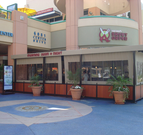 Clear drop-down shades enclosing a restaurant patio, Ventura County