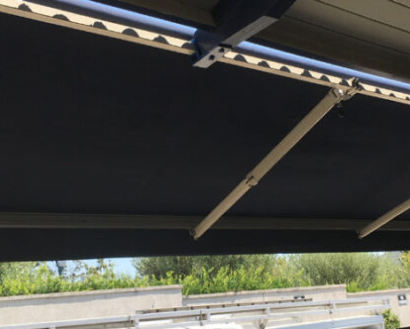 Retractable awning arms viewed from below, Orange County