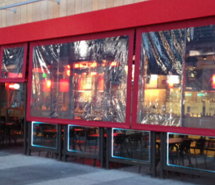 Clear patio curtains at Smashburger, Orange County