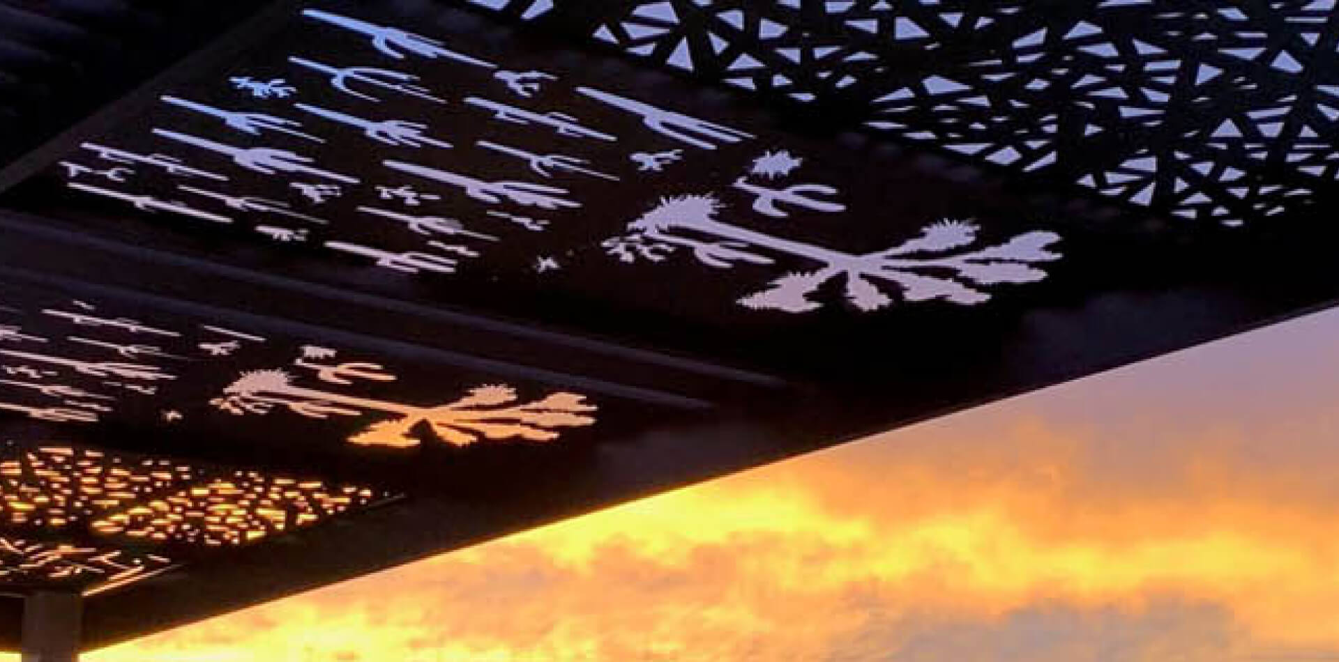 Decorative laser-cut aluminum trellis casting patterned shade, Ventura County