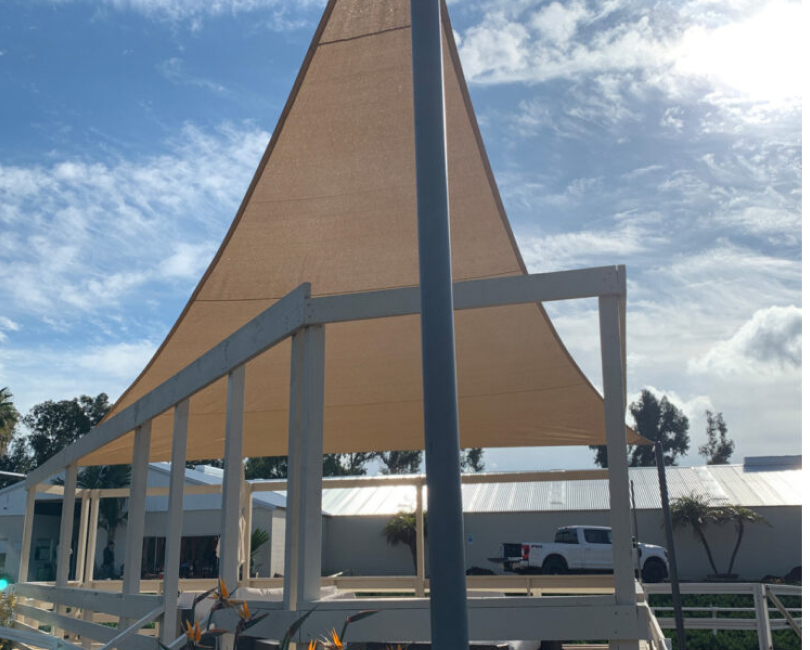 Large tan shade sail on steel columns, Riverside County