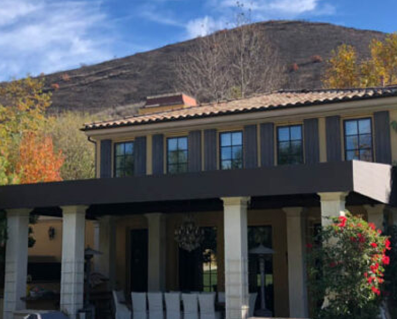 Dark patio cover above a residential terrace, Orange County