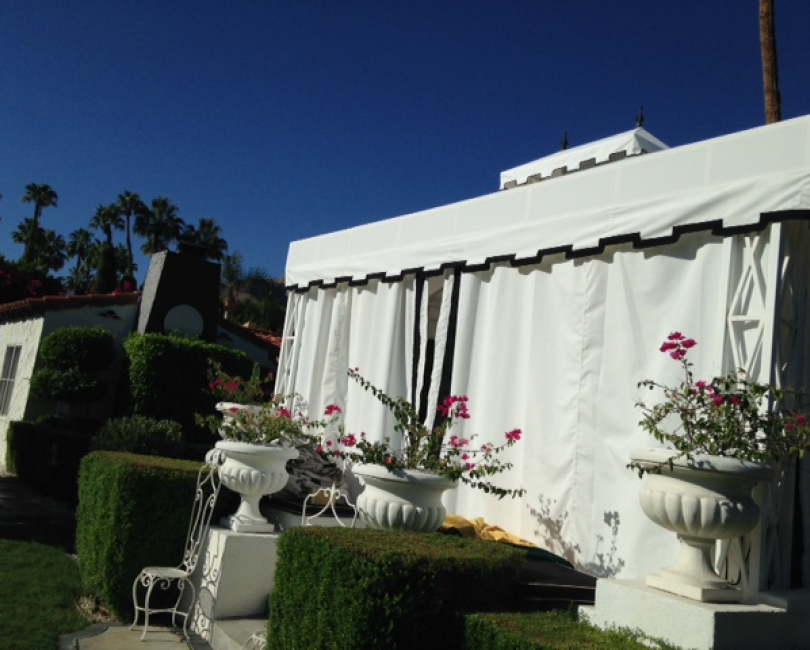 White fabric cabana with enclosed curtain panels, Ventura County
