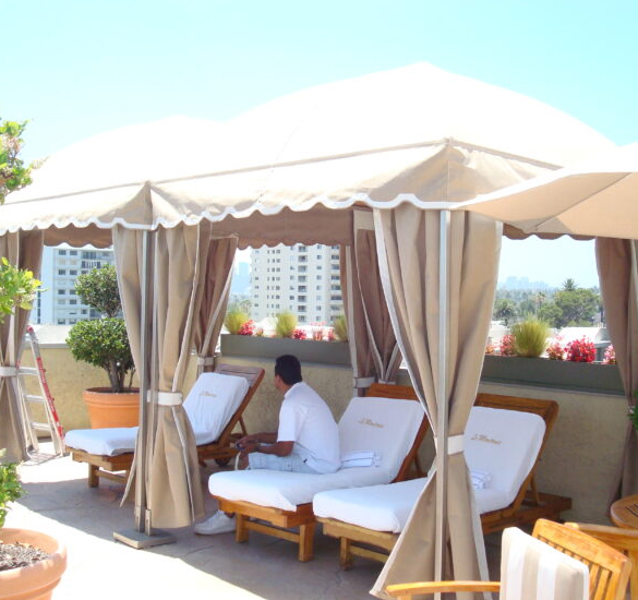 Rooftop cabana with curtains and lounge seating, Ventura County