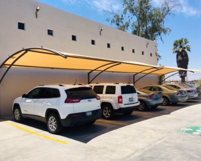 Curved fabric canopy over parked vehicles, Riverside County