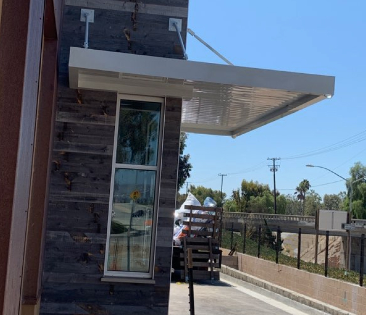 Cantilevered white metal entrance canopy, Orange County