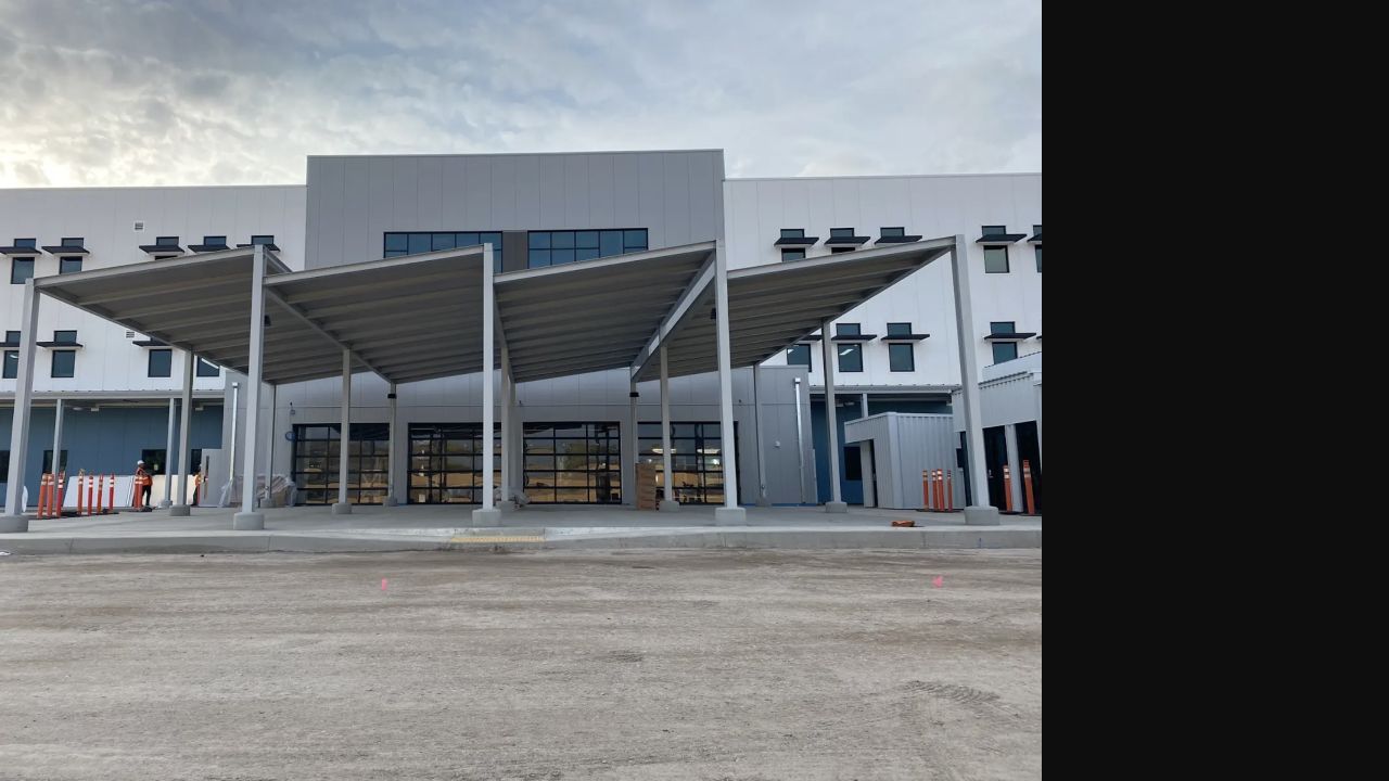 Large freestanding metal trellis structure at a commercial property
