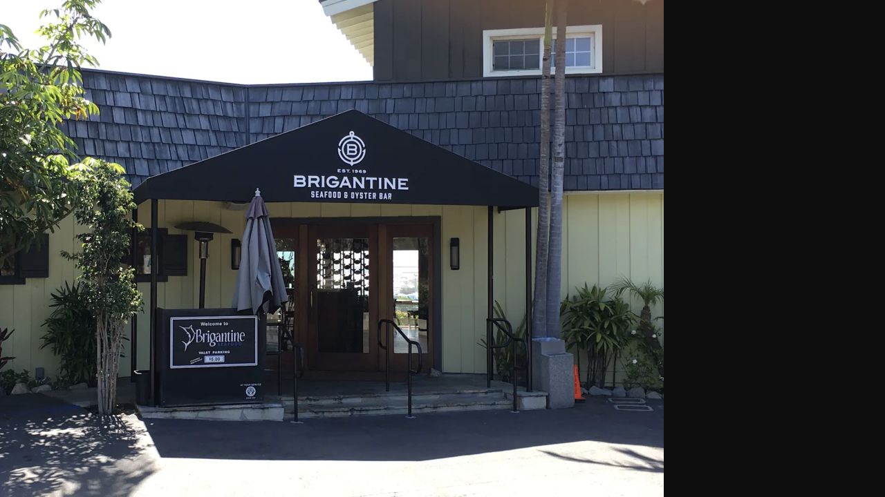 Black custom entrance canopy with Brigantine restaurant graphics