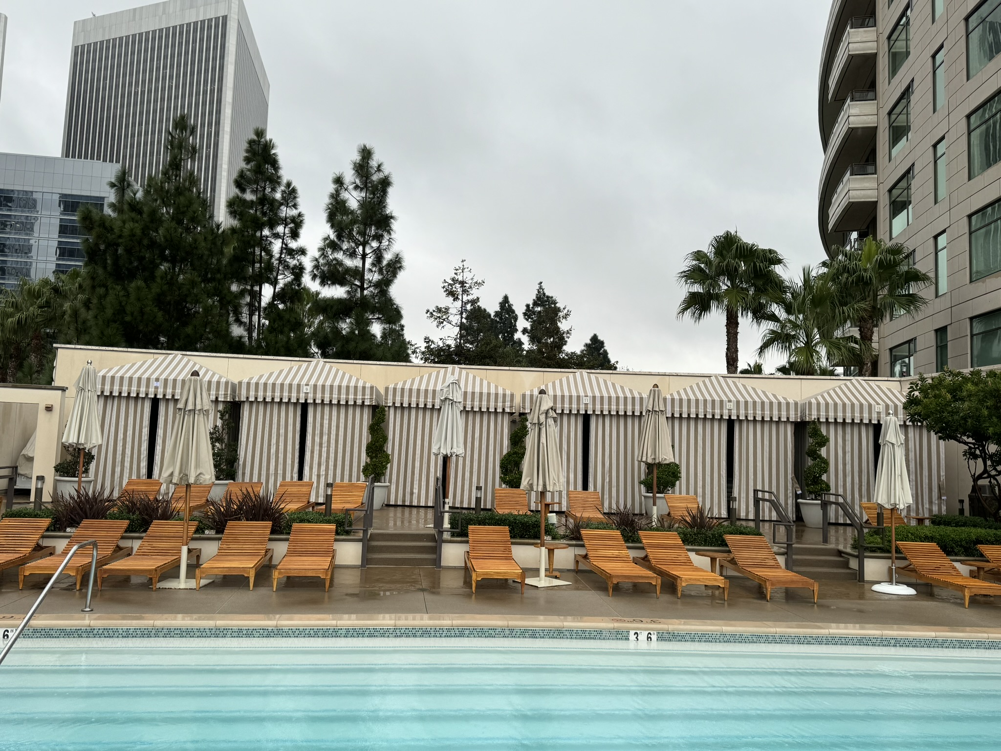 Completed row of cabanas beside a Southern California hotel pool