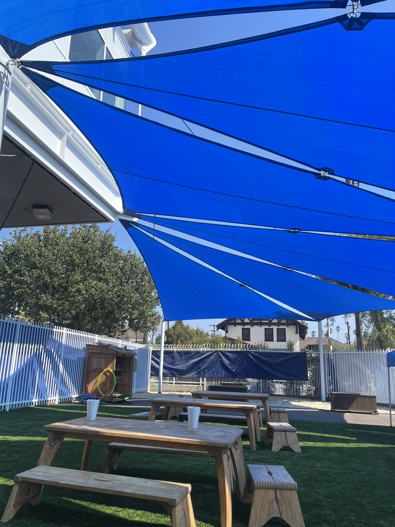 Blue tensioned shade sails installed at the La Puente Learning Center
