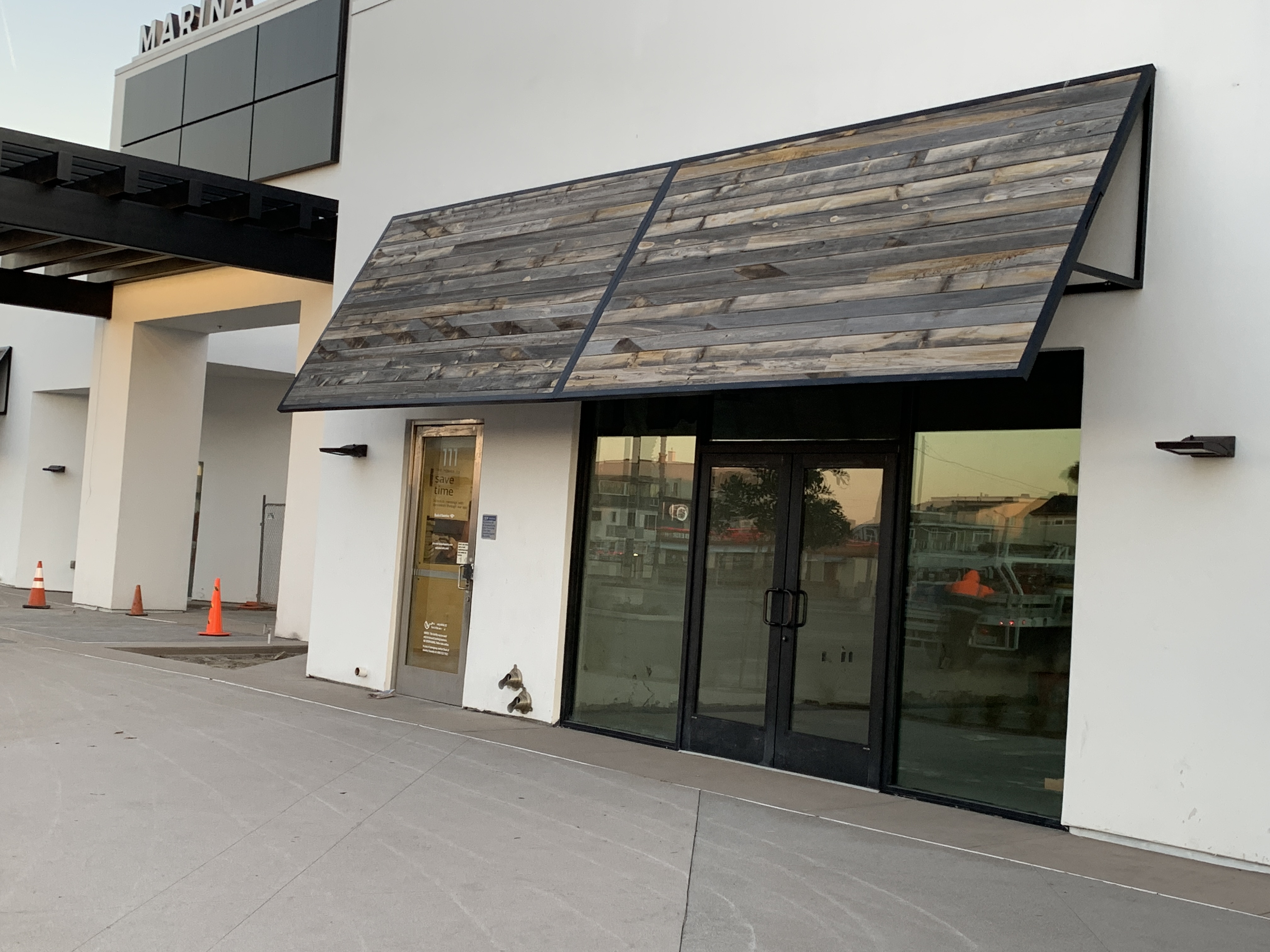 Close view of wood-look metal awnings at Peter's Landing