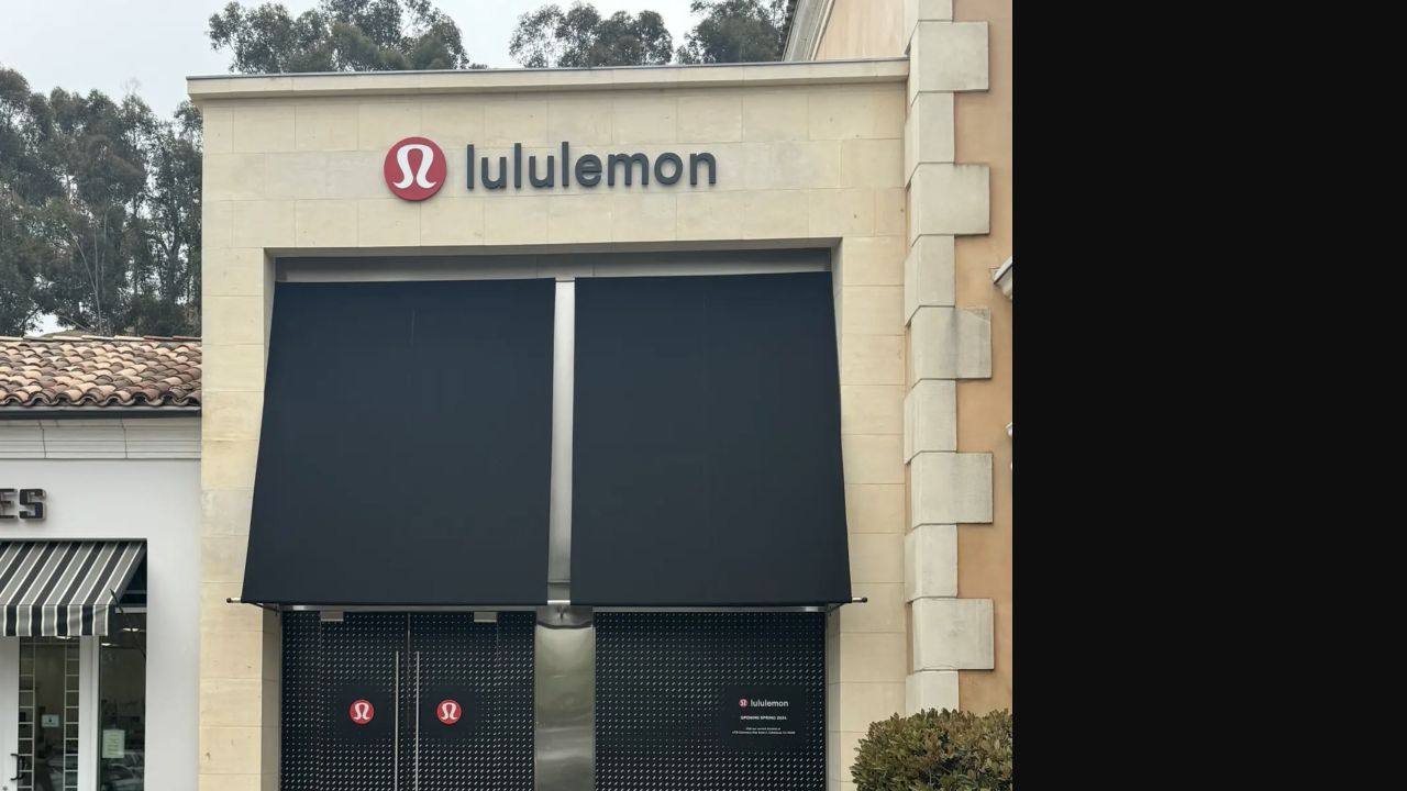 Black fixed fabric awnings installed across a lululemon storefront