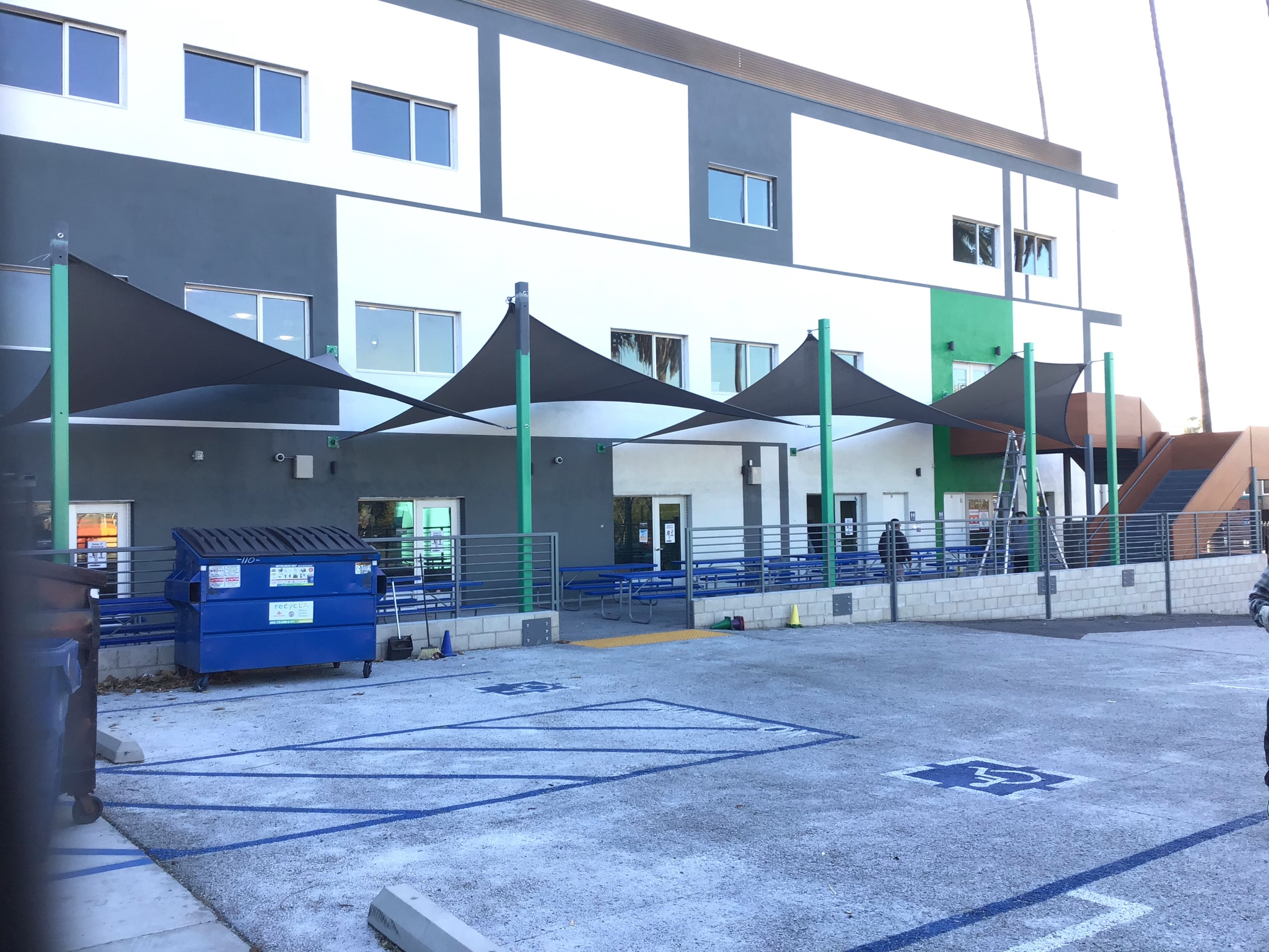 Gray shade sails covering an outdoor school lunch area in Silver Lake
