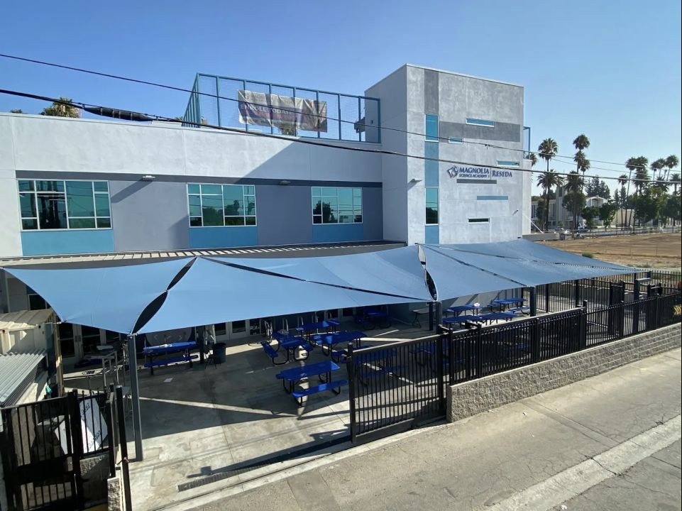 Large gray shade sails covering the outdoor lunch area at Magnolia Science Academy in Reseda