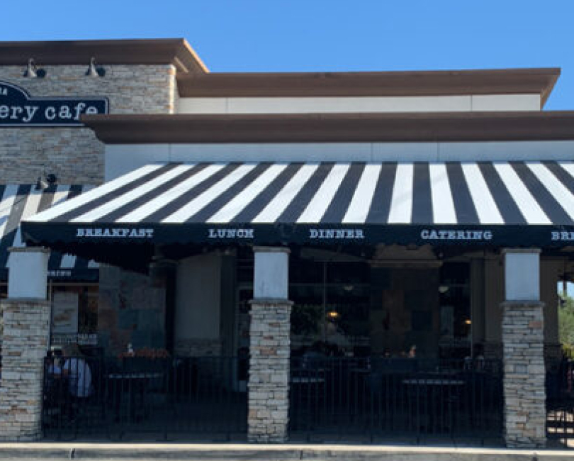 Striped patio cover above a bakery storefront, Orange County