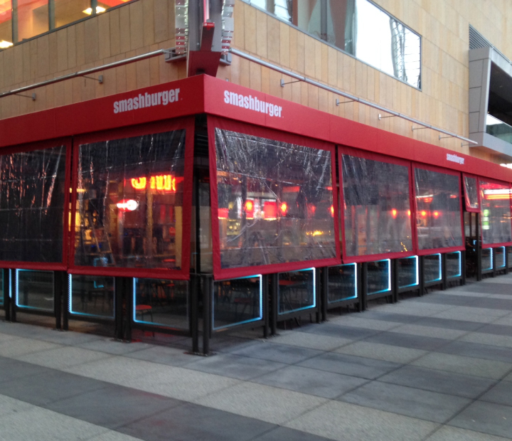 Clear patio shades enclosing Smashburger seating, Ventura County